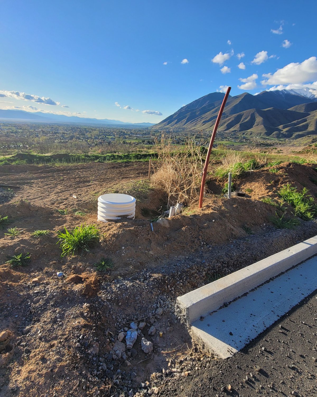 Trench dug with Utah mountain view