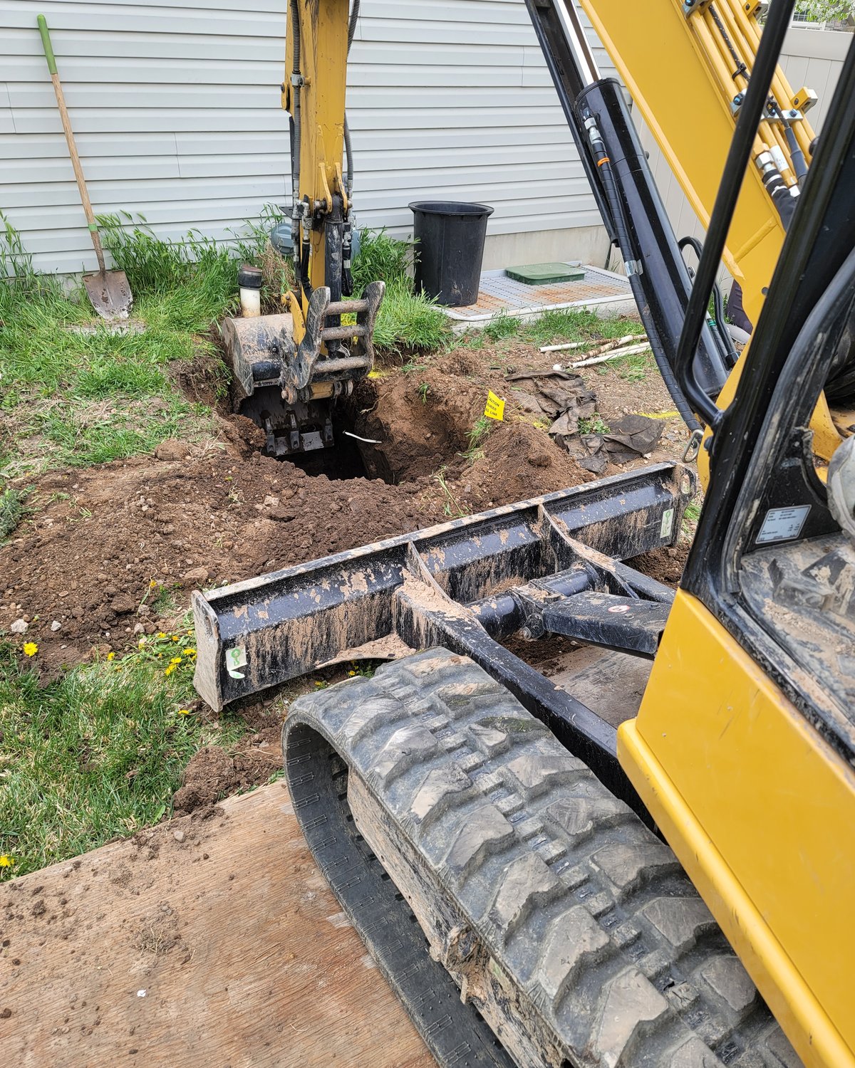 Excavator on a residential dig