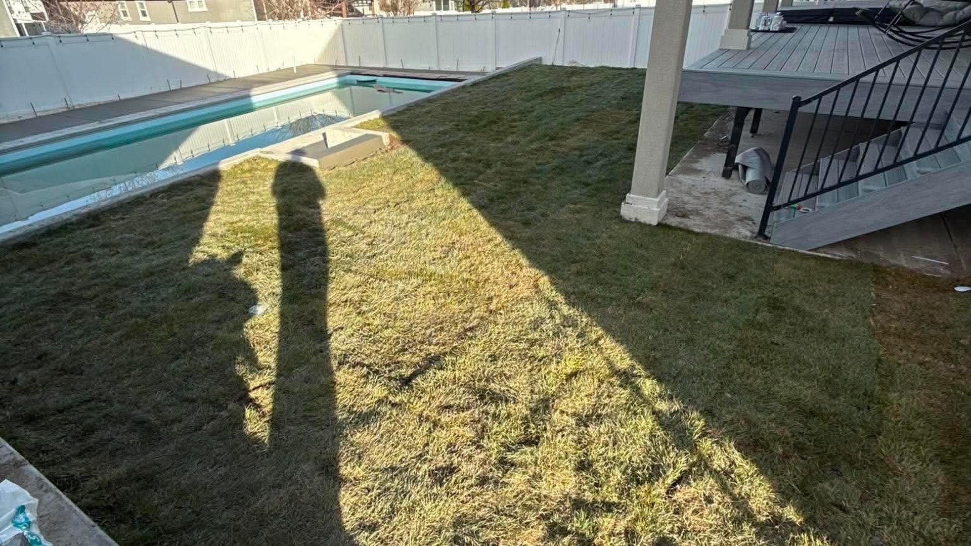 Finished Summit Landscape & Excavation project in Utah with fresh sod, concrete curbing, and mulched beds