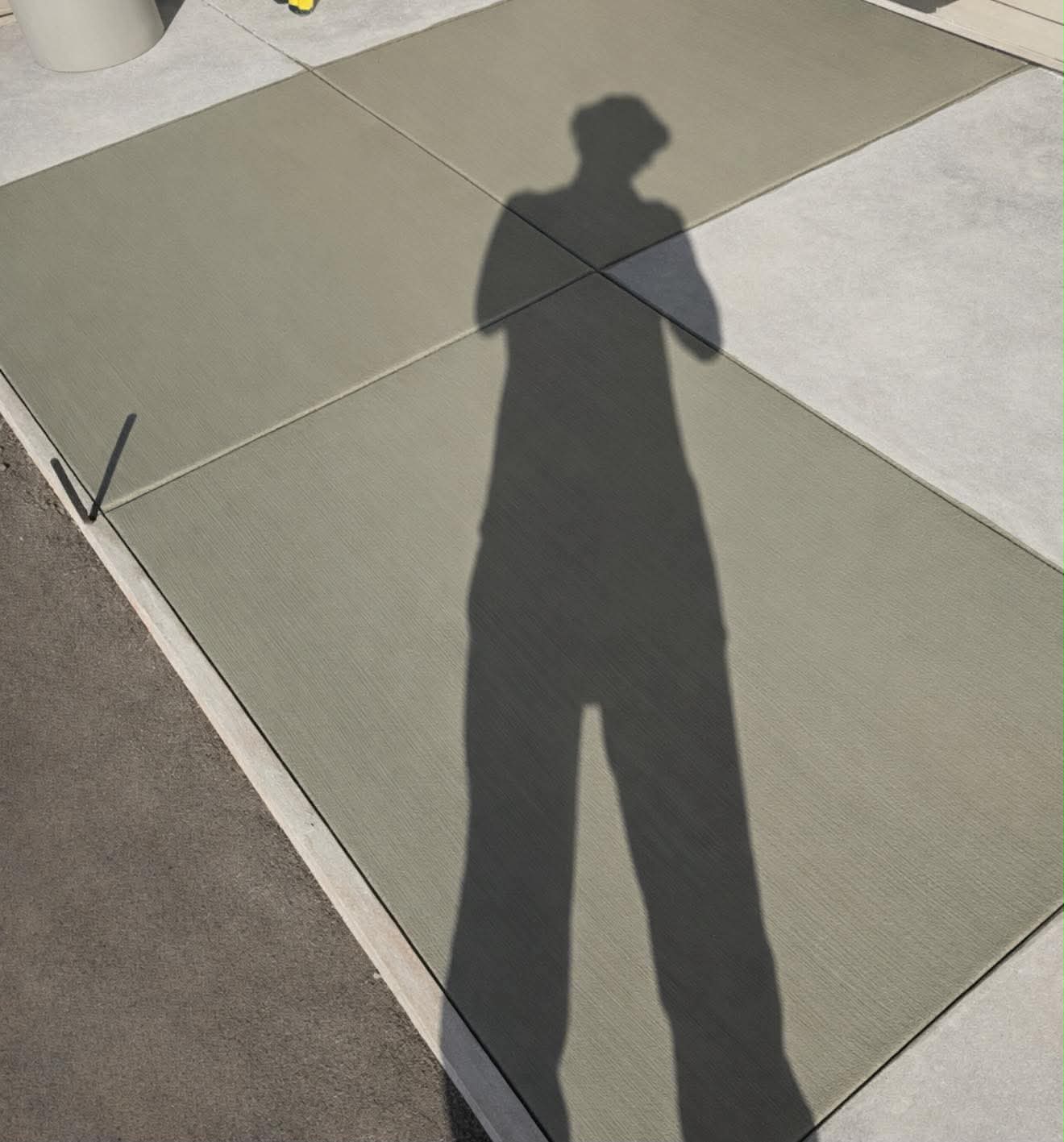 Freshly poured concrete flatwork pad